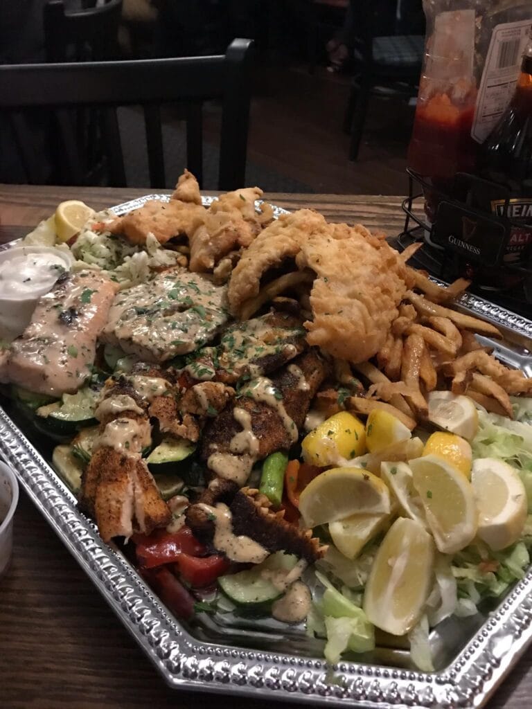 Cooked trout and fish platter from Lake Tahoe served with lemon and fries