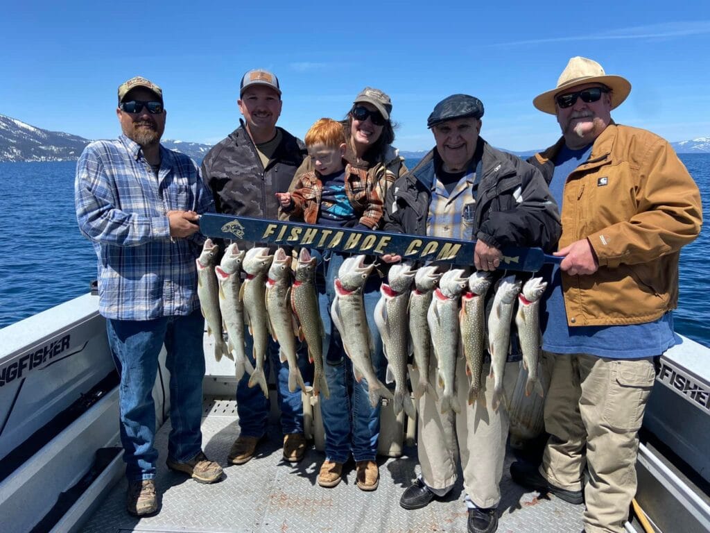 Multi-generational group showing off Lake Trout catch on Lake Tahoe charter
